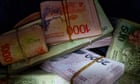 Argentina’s new government devalues peso by more than 50%