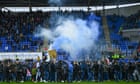 Reading match abandoned after fans storm pitch in protest against owner – video