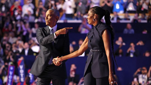 Obamas fire up DNC, warn of hard fight against Trump