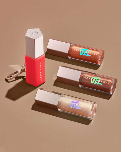 Clip-On Lip Gloss Charms - The Gloss Bomb Oil Keychain Case Makes the Fenty Lip Oil More Accessible (TrendHunter.com)