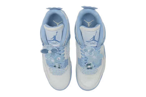 Floral Adorned Blue Sneakers - Nike Unveils the Forget Me Not Air Jordan 4 Sneaker Model (TrendHunter.com)