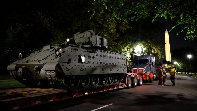 Trump vows 'very big force' against parade protesters