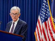 Fed holds rates steady, bucking Trump pressure