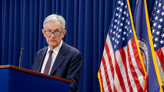 Fed holds rates steady, bucking Trump pressure