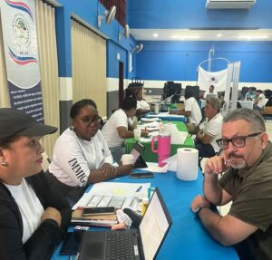 Multi-Department teams support Immigration Ministry mobile hub in Belize City