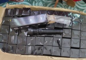 Placencia Police receive donation of flashlights for community safety