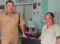 Assistant Commissioner of Police Howell Gillett provides desktop computers to support educational programs at primary schools