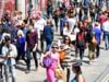 UK shoppers return to high street as warm weather brings respite from shadow of war