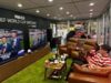 ‘The perfect job’: meet the fans being paid to watch all 104 World Cup games in Times Square