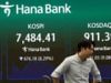 Global stock markets fall as concerns persist over tech firms at heart of AI boom