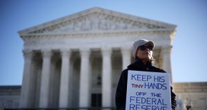 Supreme Court lets Trump fire officials, except at Fed