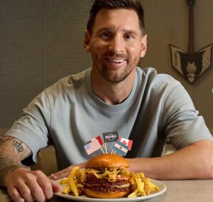 International News: Ahead of historic 6th World Cup, global football icon Messi unveils new burger and suite experience