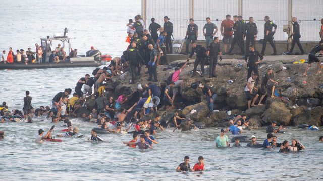 Migrants overwhelm Spanish enclave